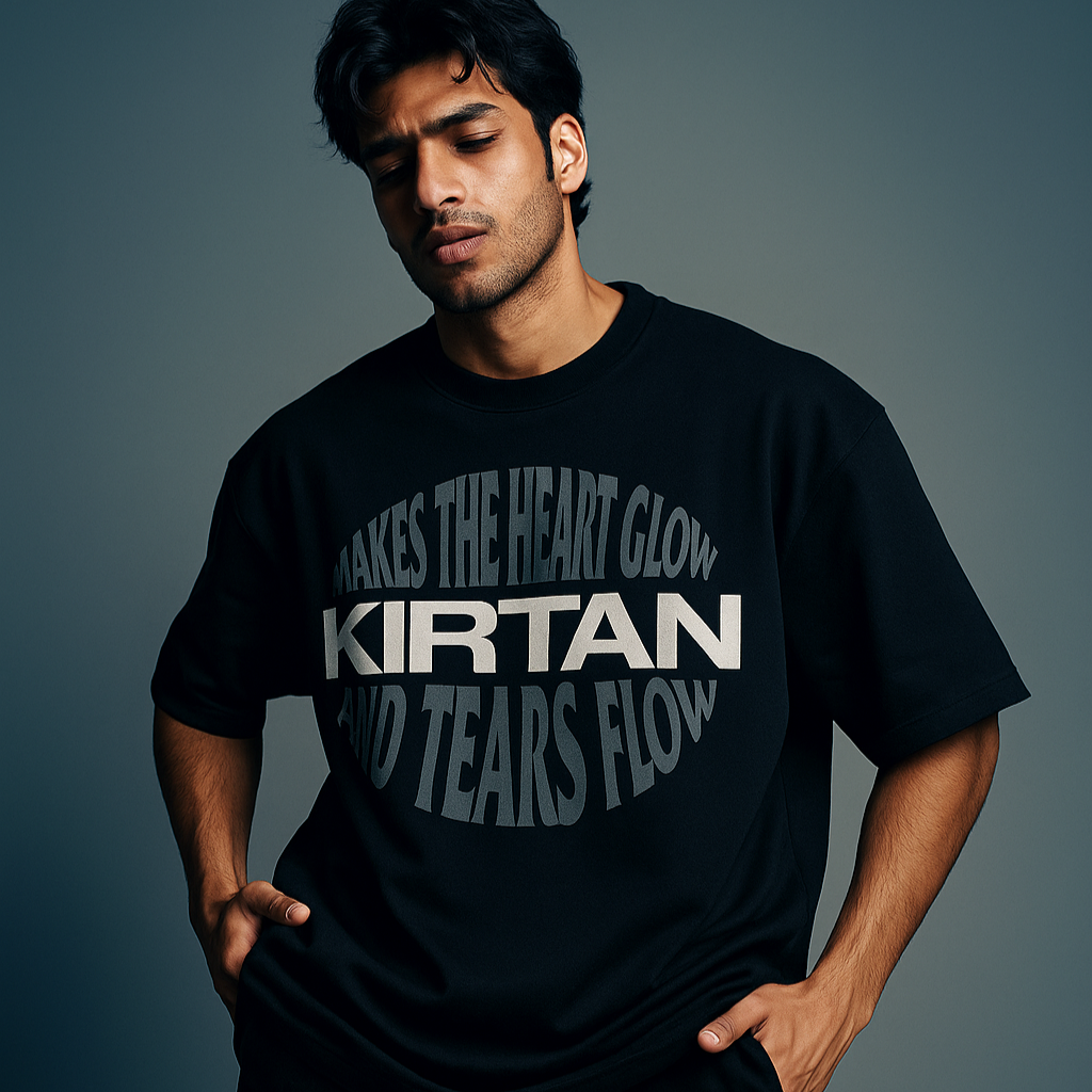 Man wearing a black t-shirt with text against a gray background