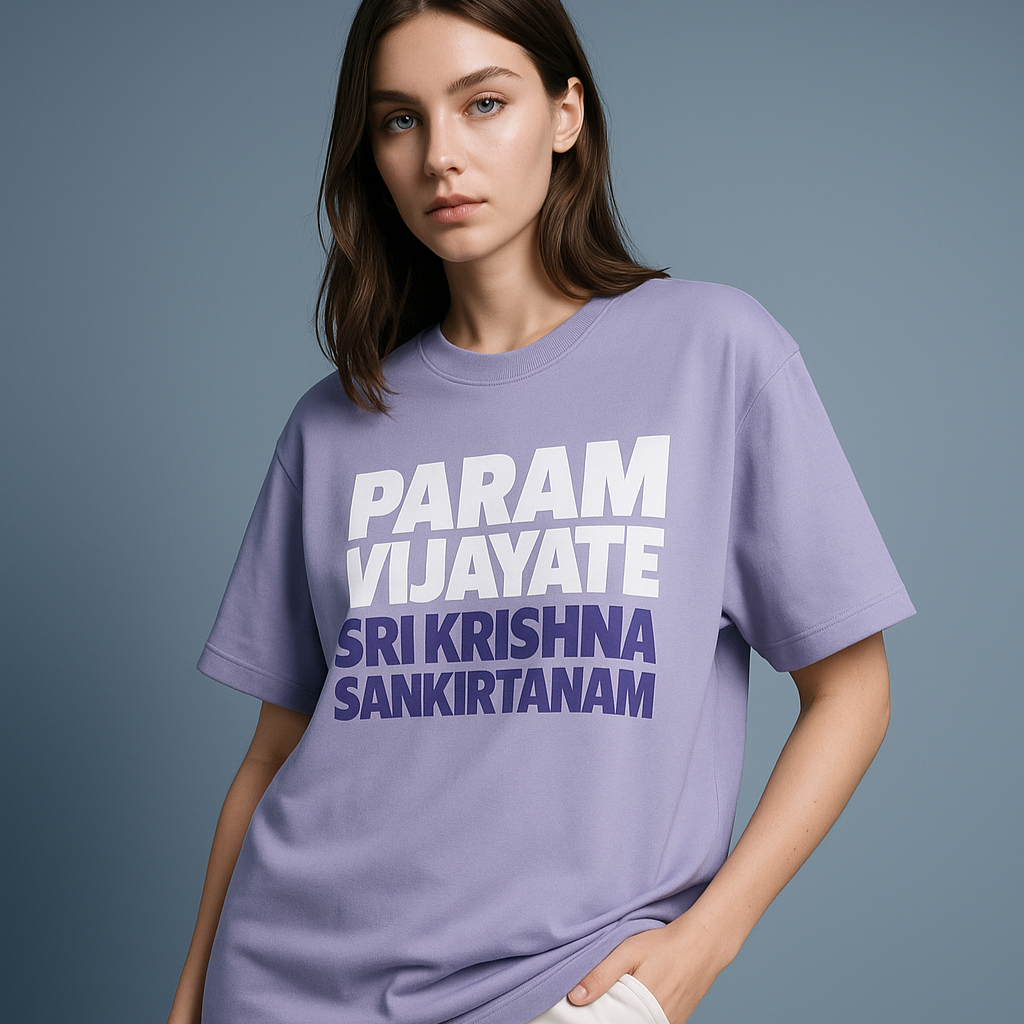 Person wearing a purple t-shirt with white and blue text on a gray background