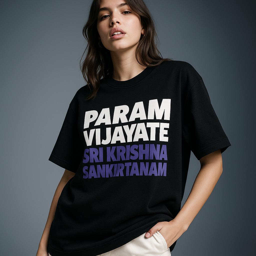 Person wearing a black t-shirt with white and purple text against a gray background