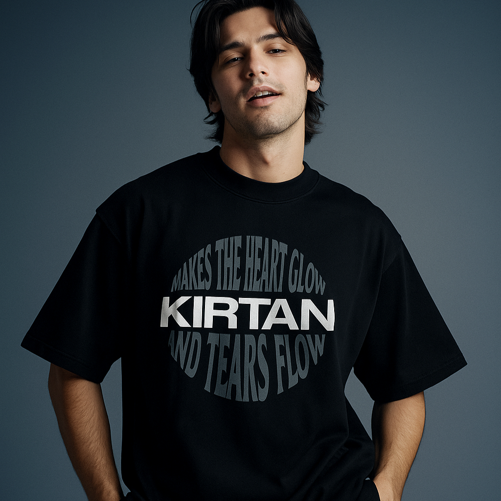 Person wearing a black t-shirt with white text on a dark background