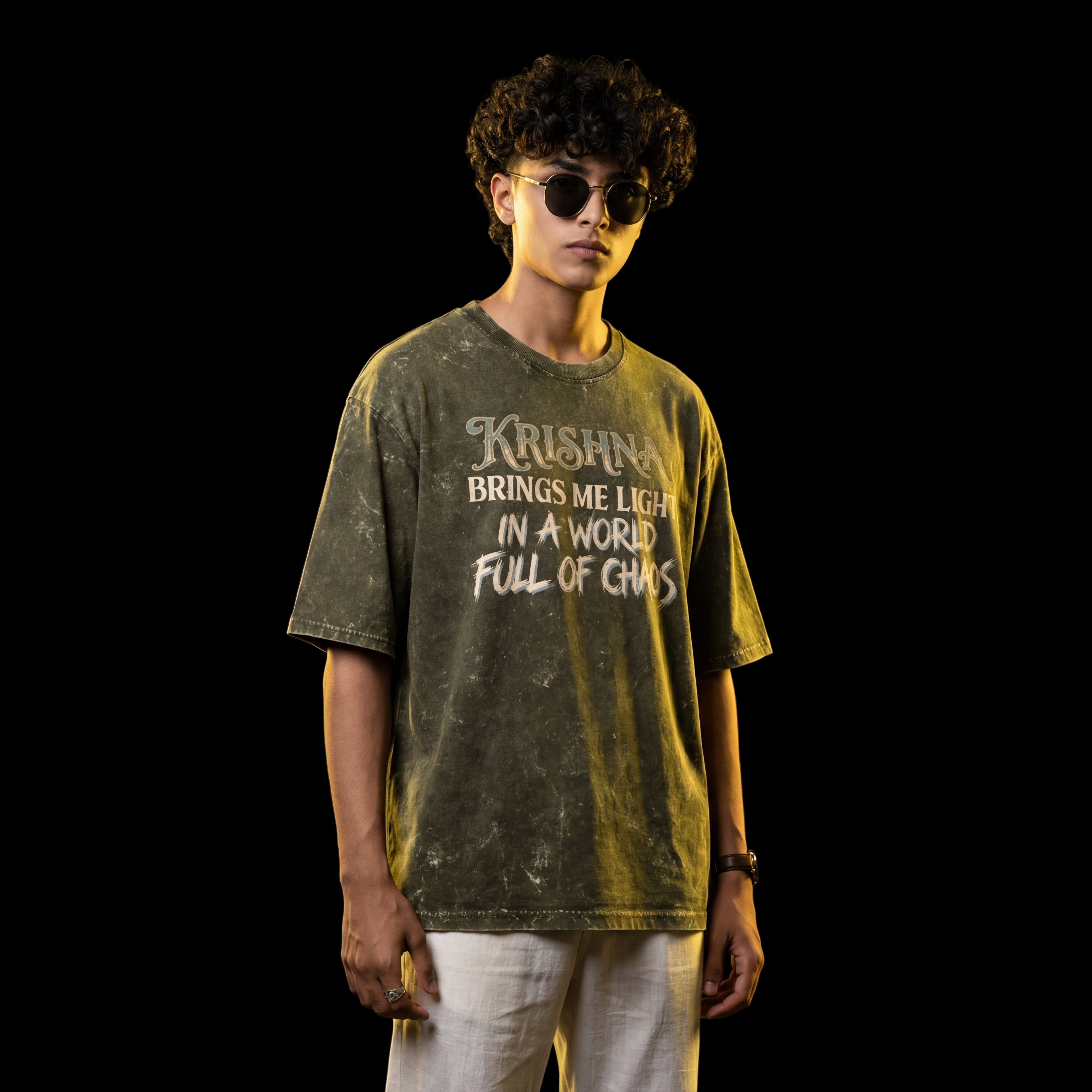 Person wearing a t-shirt with text against a dark background