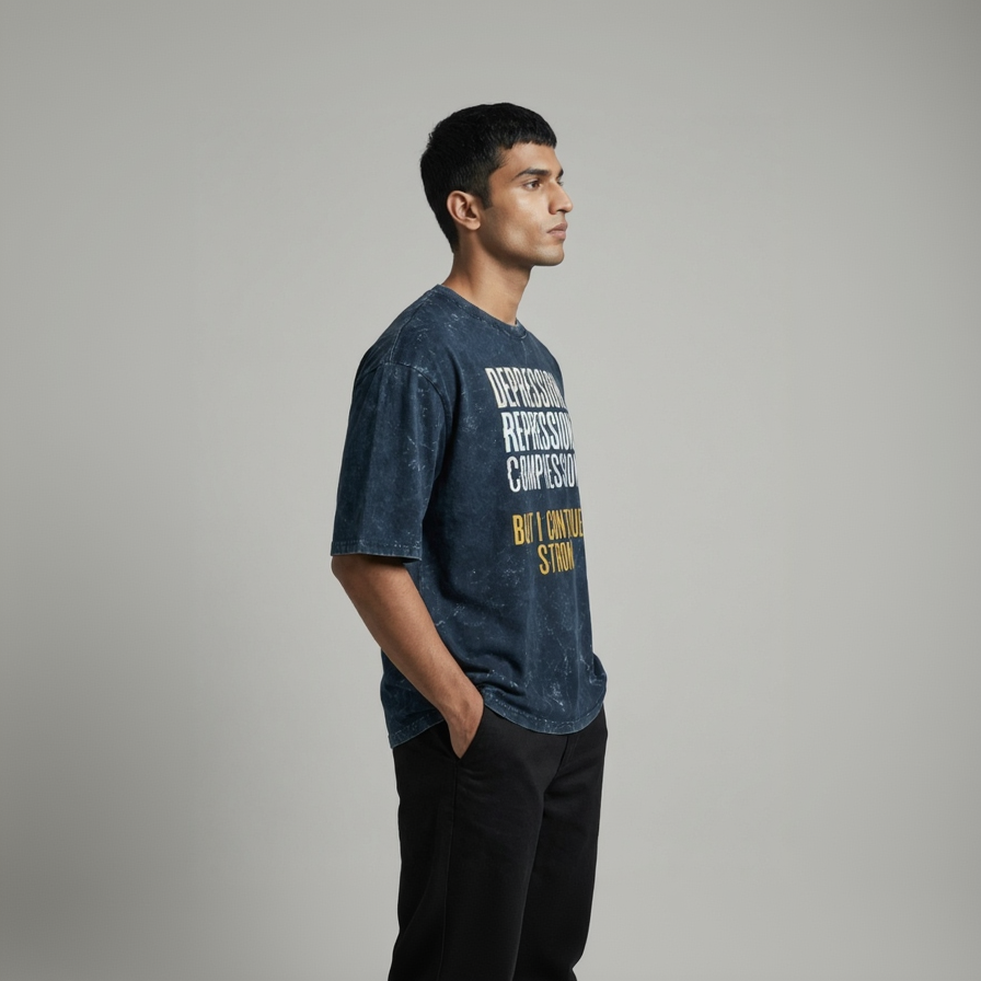 Man wearing a blue t-shirt with text on a gray background