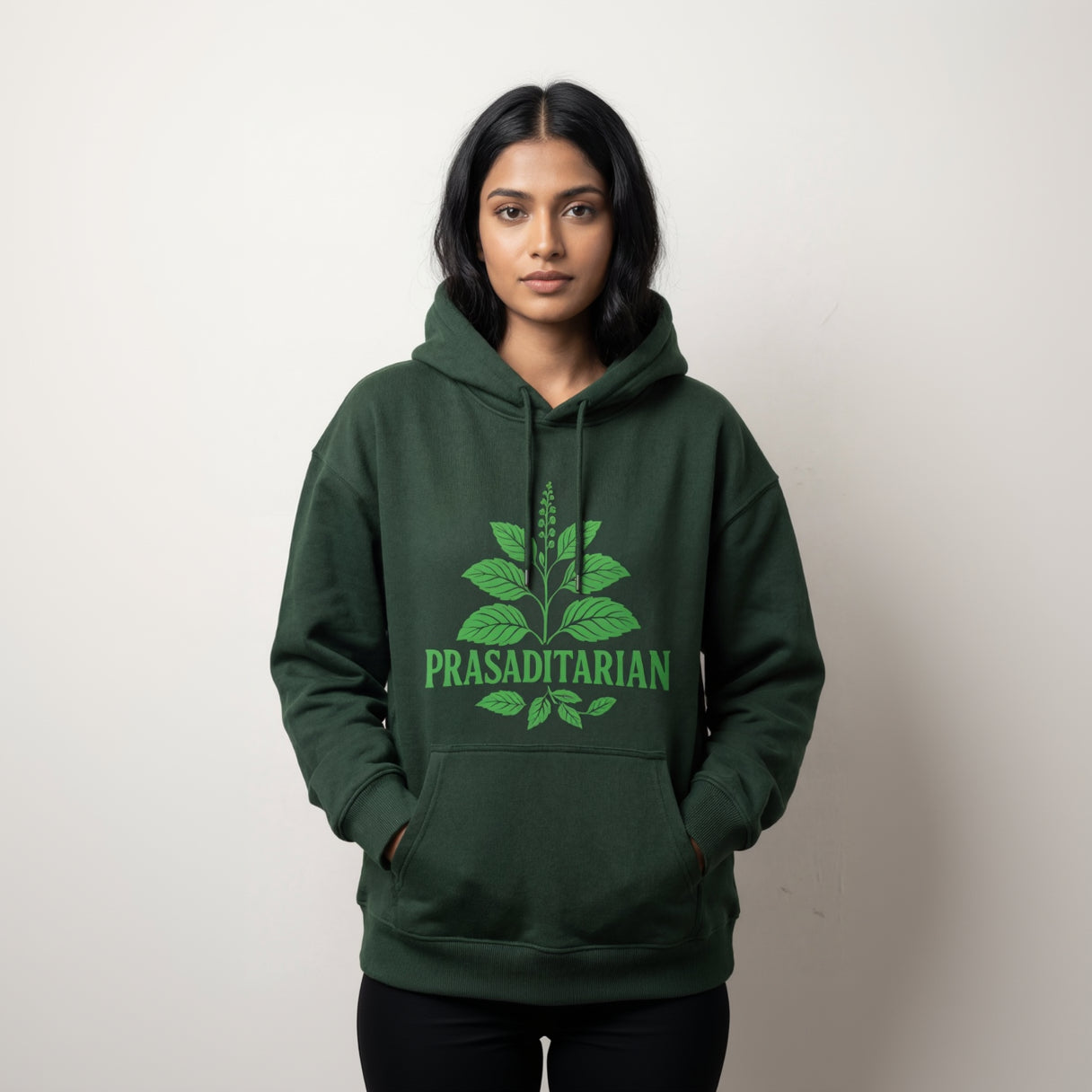 Person wearing a green hoodie with 'Prasaditarian' design on a white background